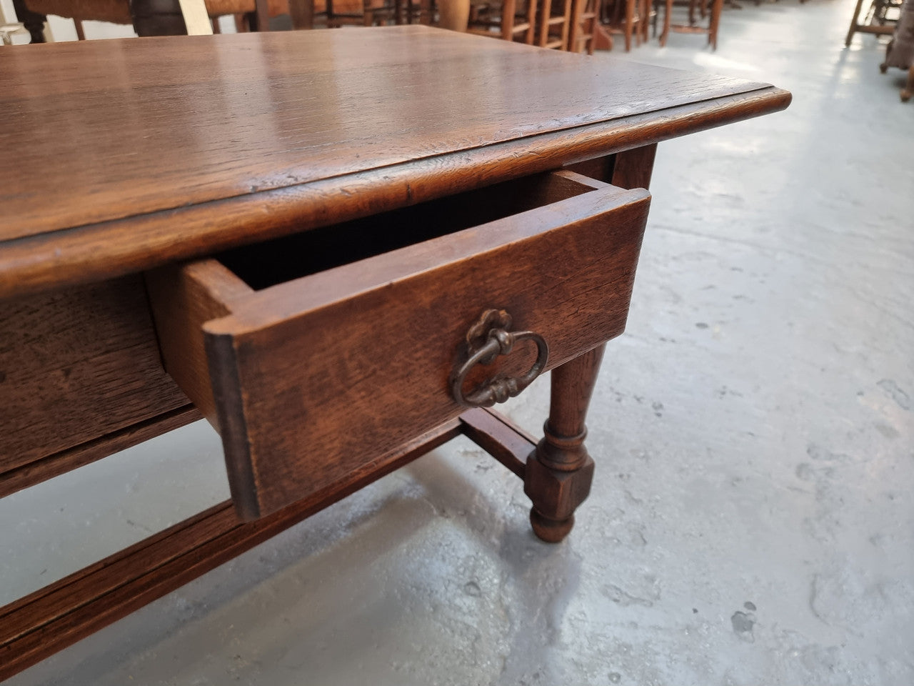 Beautiful French oak 2 drawer coffee table. In good original detailed condition.
