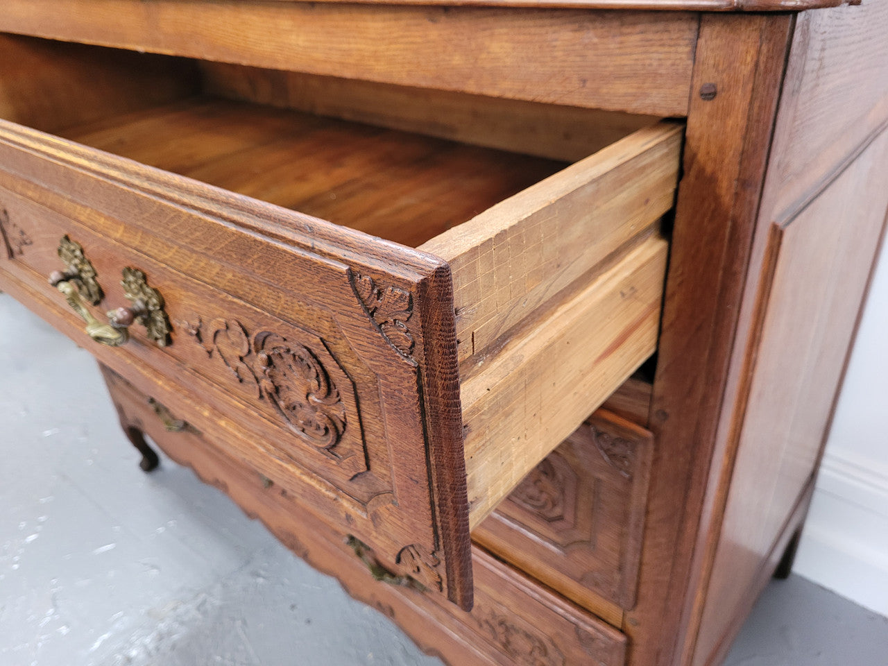 French Louis 15th style large three drawer chest featuring carved drawers. It has been sourced from France and is in good original detailed condition.