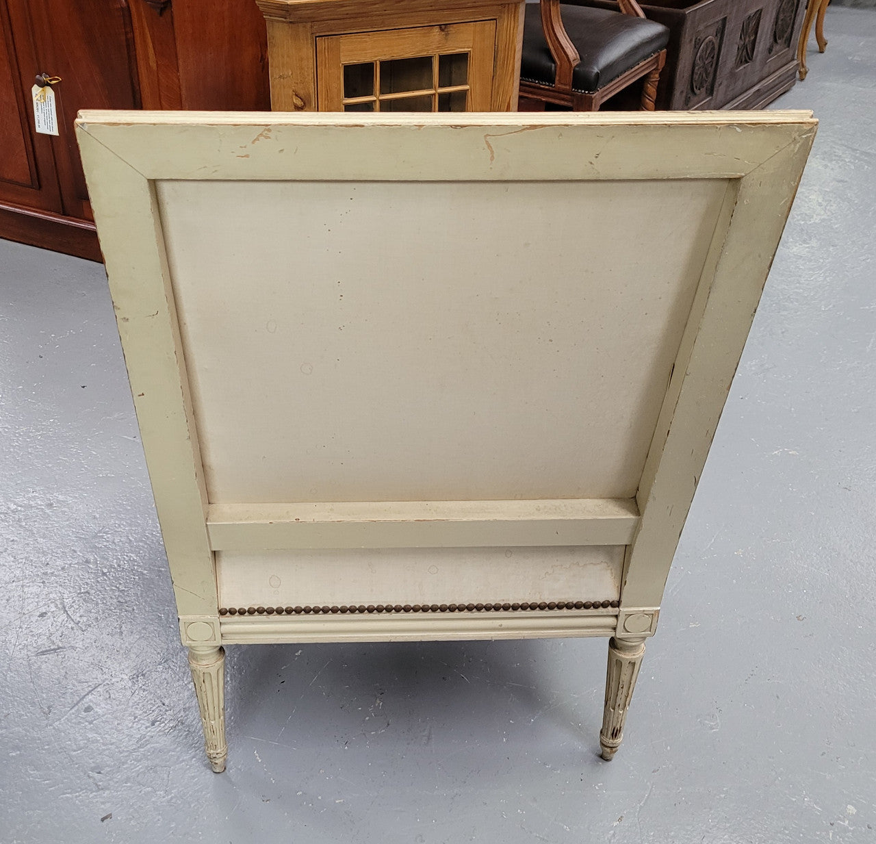 Louis 16th Style high back upholstered chair with maroon velvet fabric, decorative carvings and original paint. It has been sourced from France and in good original condition.