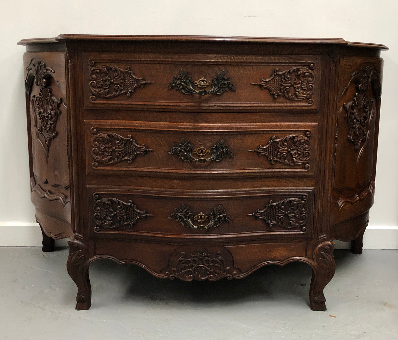 French Louis XV style dark Oak carved, two door and three drawer Commode /side cabinet. Could also be used as a TV cabinet or in the bedroom as storage very versatile. In good original detailed condition.