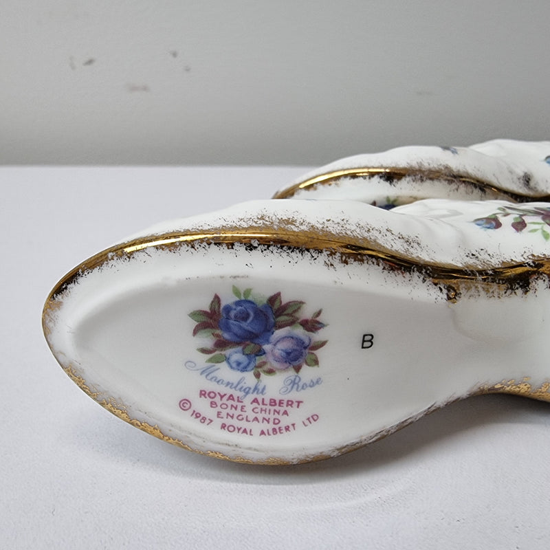 A lovely pair of Royal Albert China shoes in good original condition. Stamped on the sole 'Moonlight Rose: Royal Albert Bone China, England ©1987.