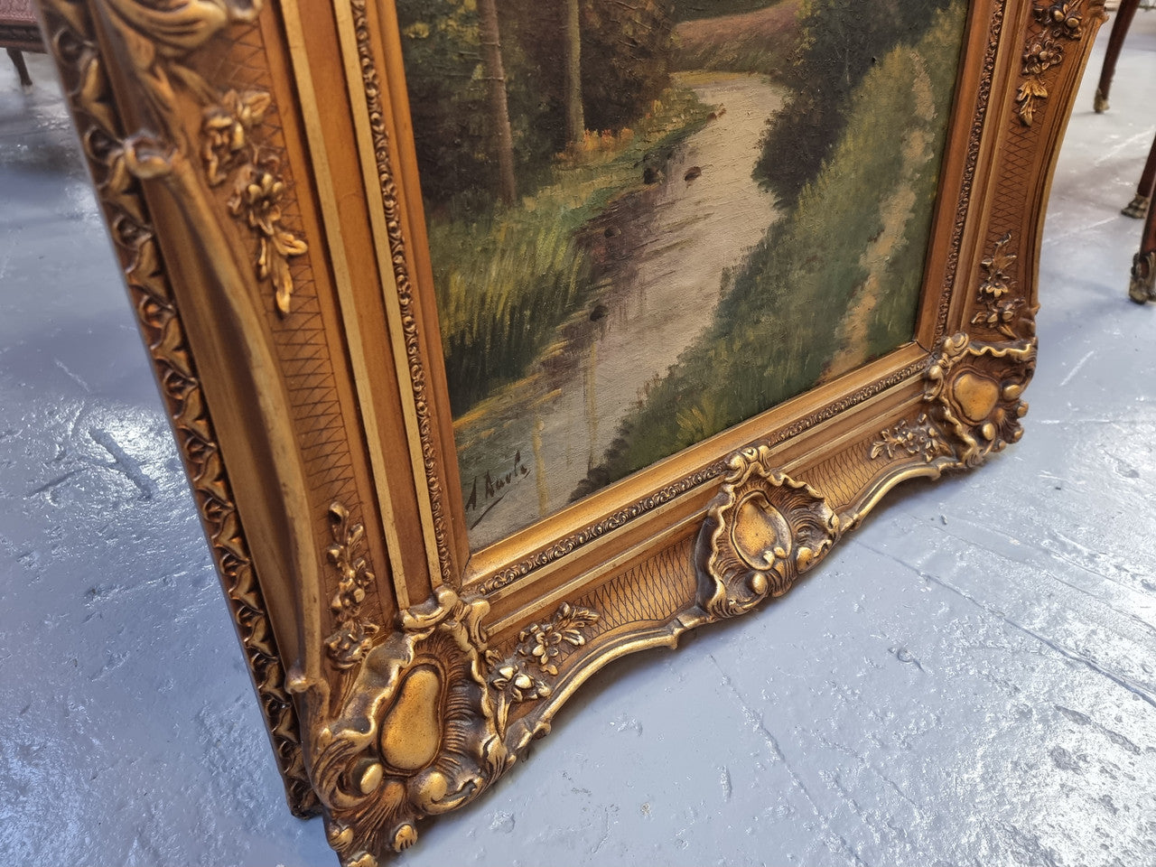 Lovely signed landscape river scene oil on canvas framed in a beautiful ornate frame and in good original condition.