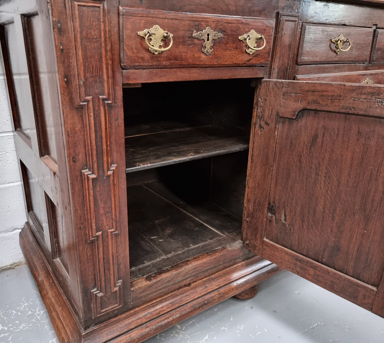 18th Century English Oak Farmhouse dresser of grand proportions. It was sourced in France and not only looks amazing but also has plenty of practical storage space. It is in good original detailed condition.