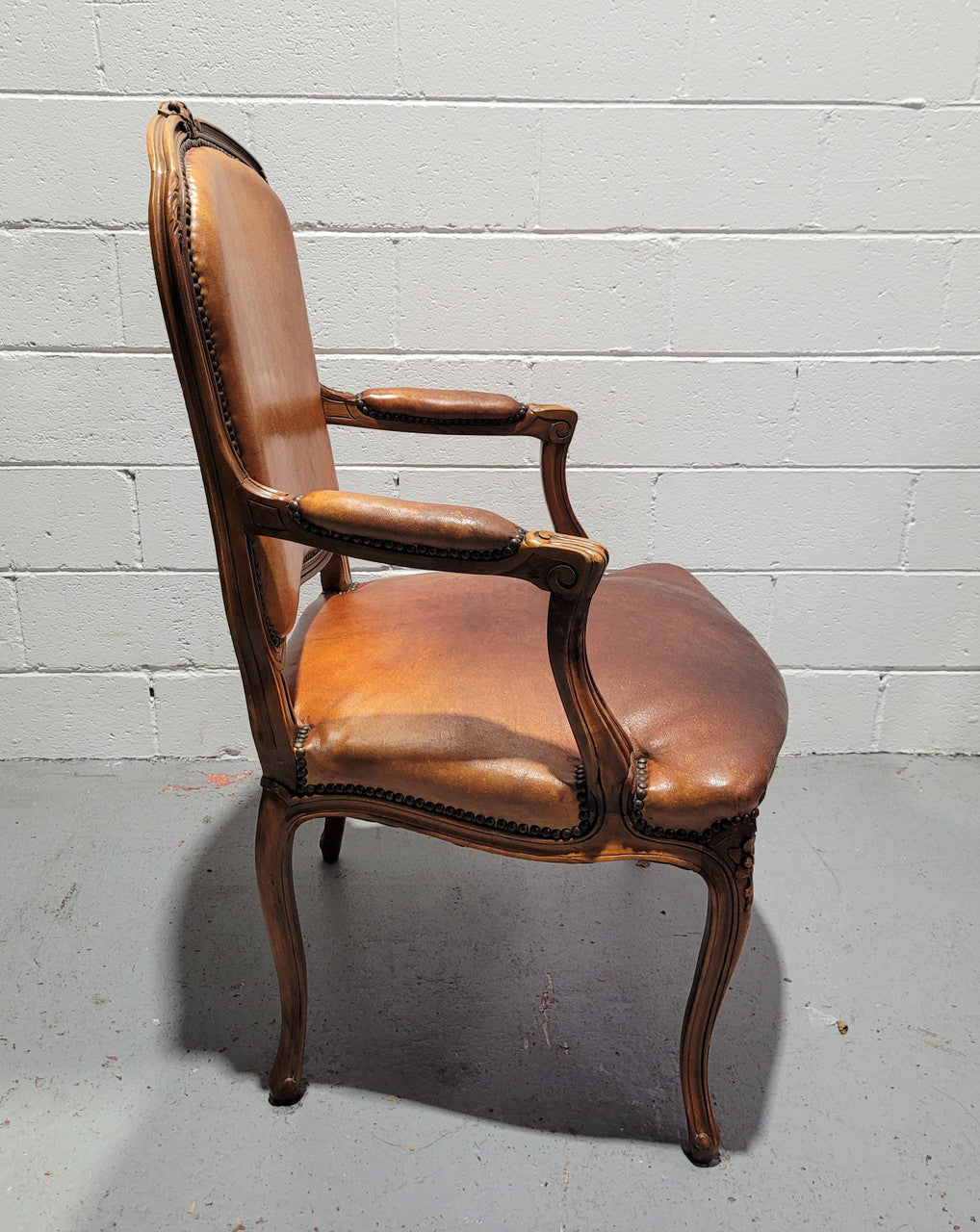 French Walnut Louis XV style desk chair with faux leather upholstery. The upholstery is in good original condition and very comfortable to sit in.