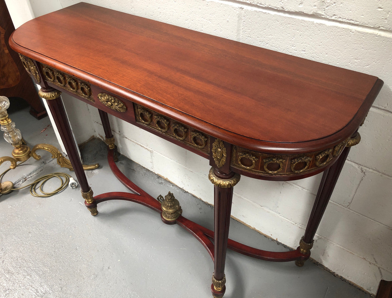 Fully restored decorative French style mahogany console table, with beautiful ormolu mounts and in very good condition.