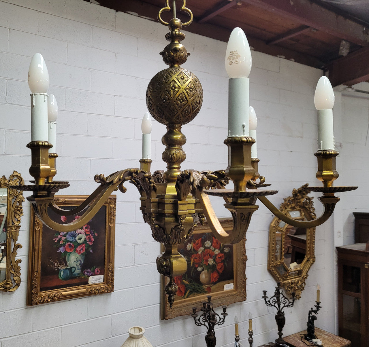 Stunning six arm French bronze chandelier. It can be used with or without shades. It has been fully rewired to Australian standards. It is in good original detailed condition.