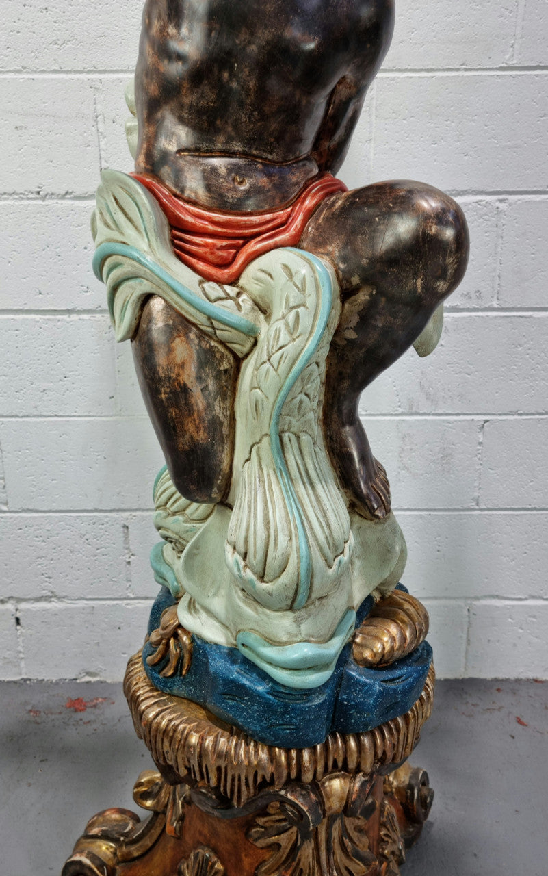 19th Century Italian Wooden Blackamoor lamp sourced in France. Made from carved wood painted & gilded. Amazing detail of a man playing a horn that then turns into a chandelier while riding a mythological sea serpent It has been fully rewired to Australian standards.