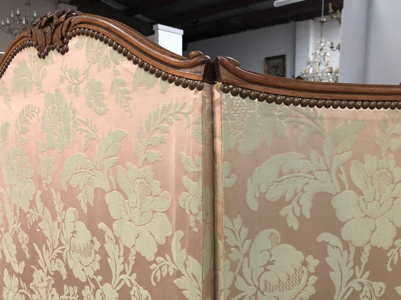 An antique French Walnut louis XVI style 3 fold screen/divider. Upholstered with beautiful pink silk brocade fabric. The fabric is in good overall condition with some minor wear and tear which is expected for its age. It has been sourced directly from France. Please view photos as they help to form part of the description and condition.