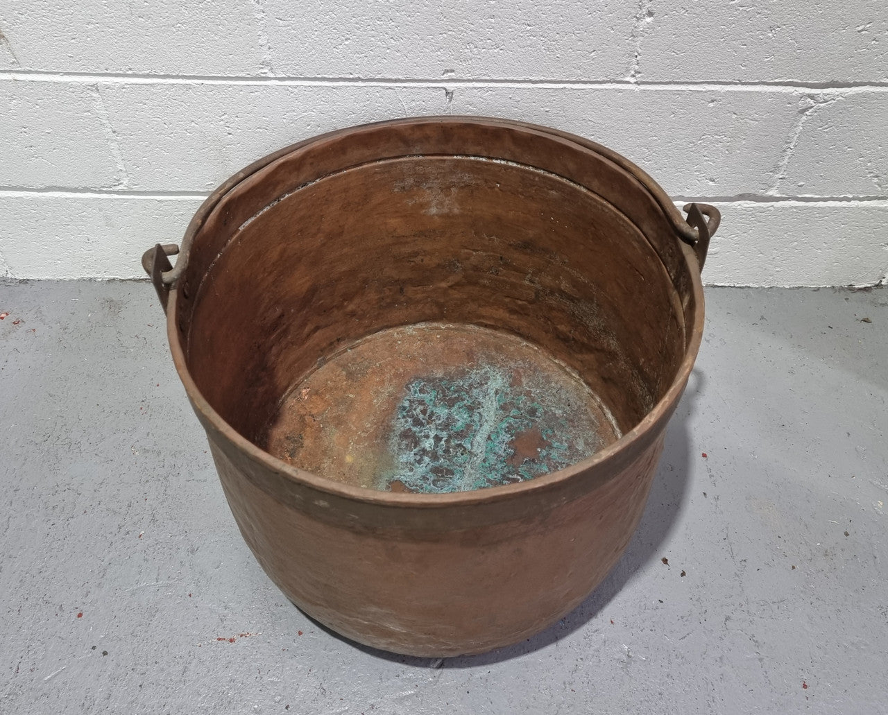 Large Antique French copper cauldron with metal band around rim. It is in good original condition.