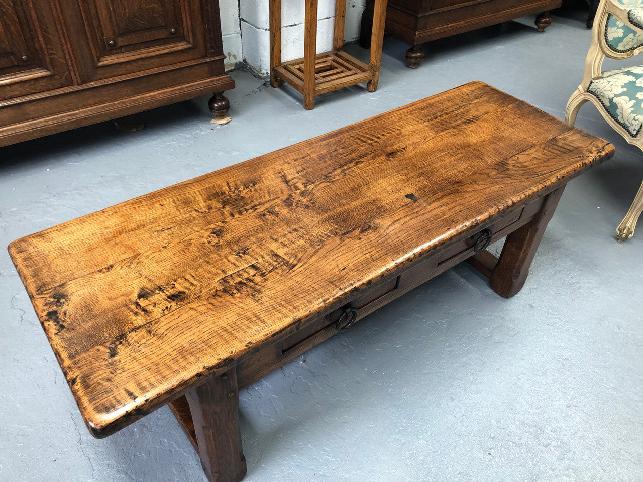 Fabulous small French oak coffee table, with two drawers and lovely character in good condition.