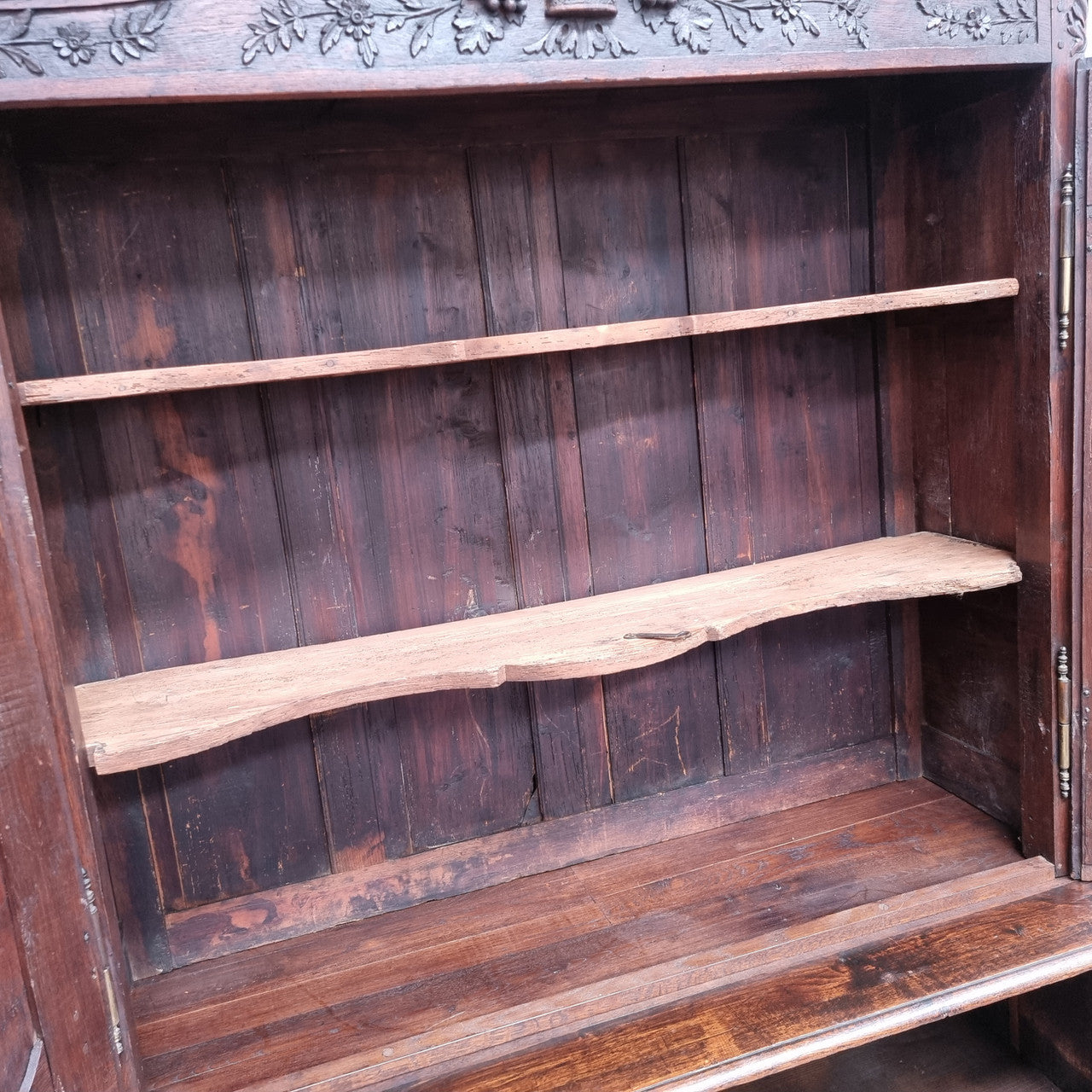 French Oak 18th Century superbly carved sideboard buffet. This amazing buffet has loads of character which is expected being circa 1790's. The top section has two fixed shelves and the bottom section has one fixed shelf. It has been sourced from France and is in good original detailed condition.