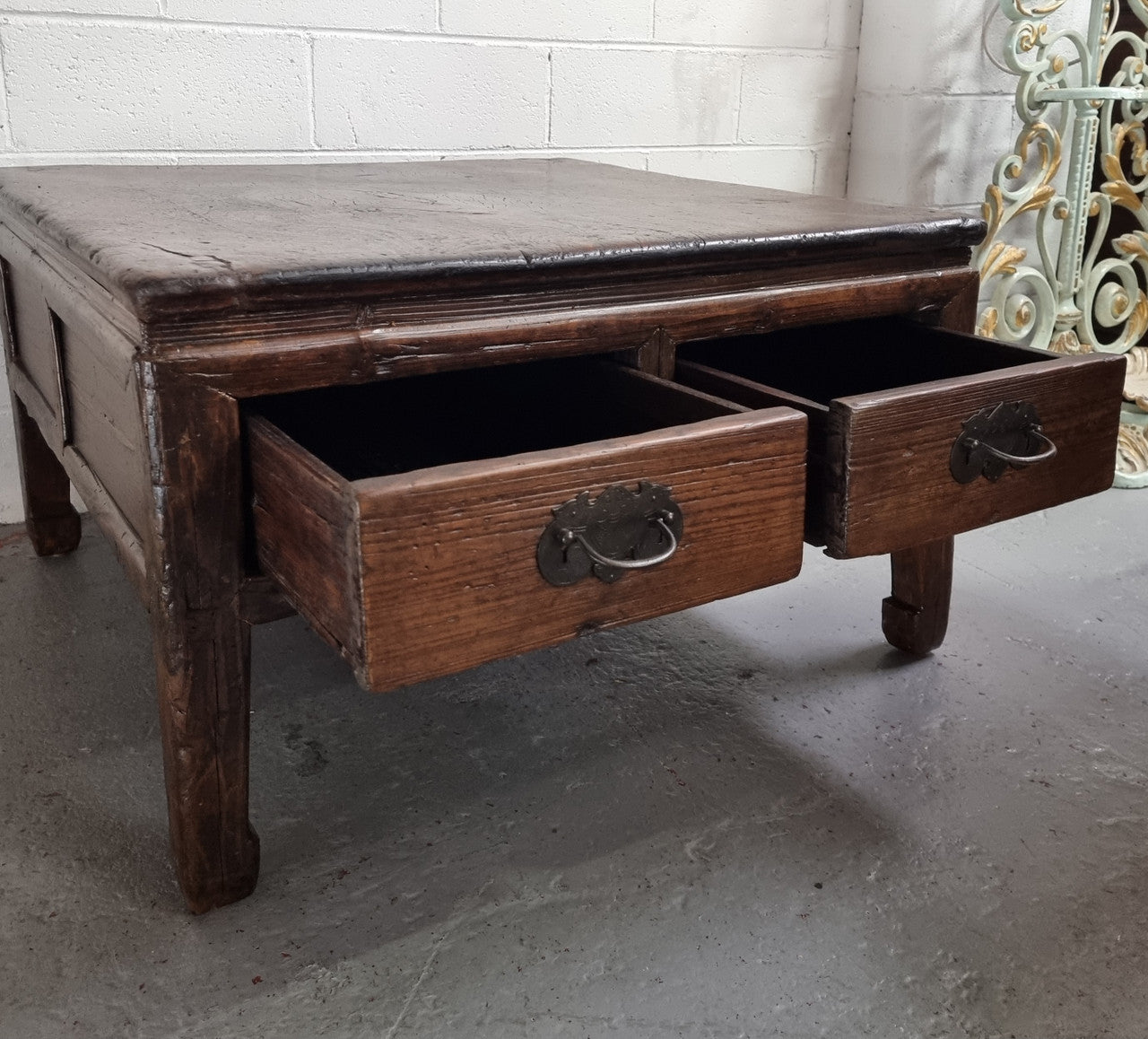 Square Elm coffee table with oriental legs and two long drawers. Beautifully finished and in good original condition. It has been sourced from France.