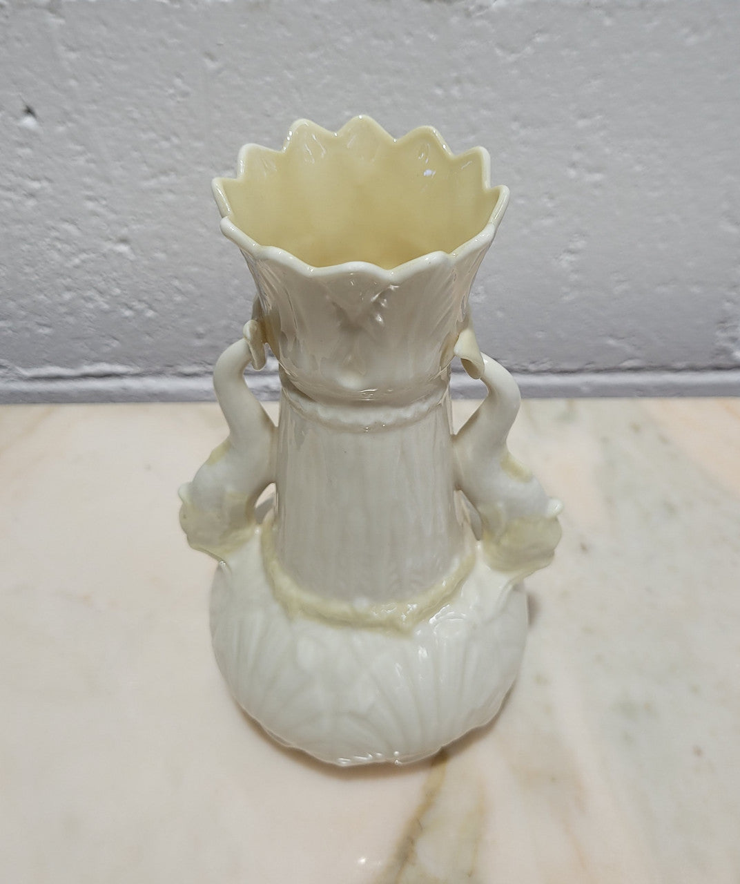 Vintage Belleek Double Handled Fish Vase. Scalloped shell pattern on base & delicate fish handles. Brown Mark 1980 – 1933.