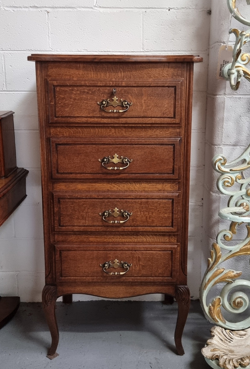 Elegant French Oak Louis XV style four drawer chest of drawers. It has lovely carvings and it is in good original detailed condition. It has been sourced from France.