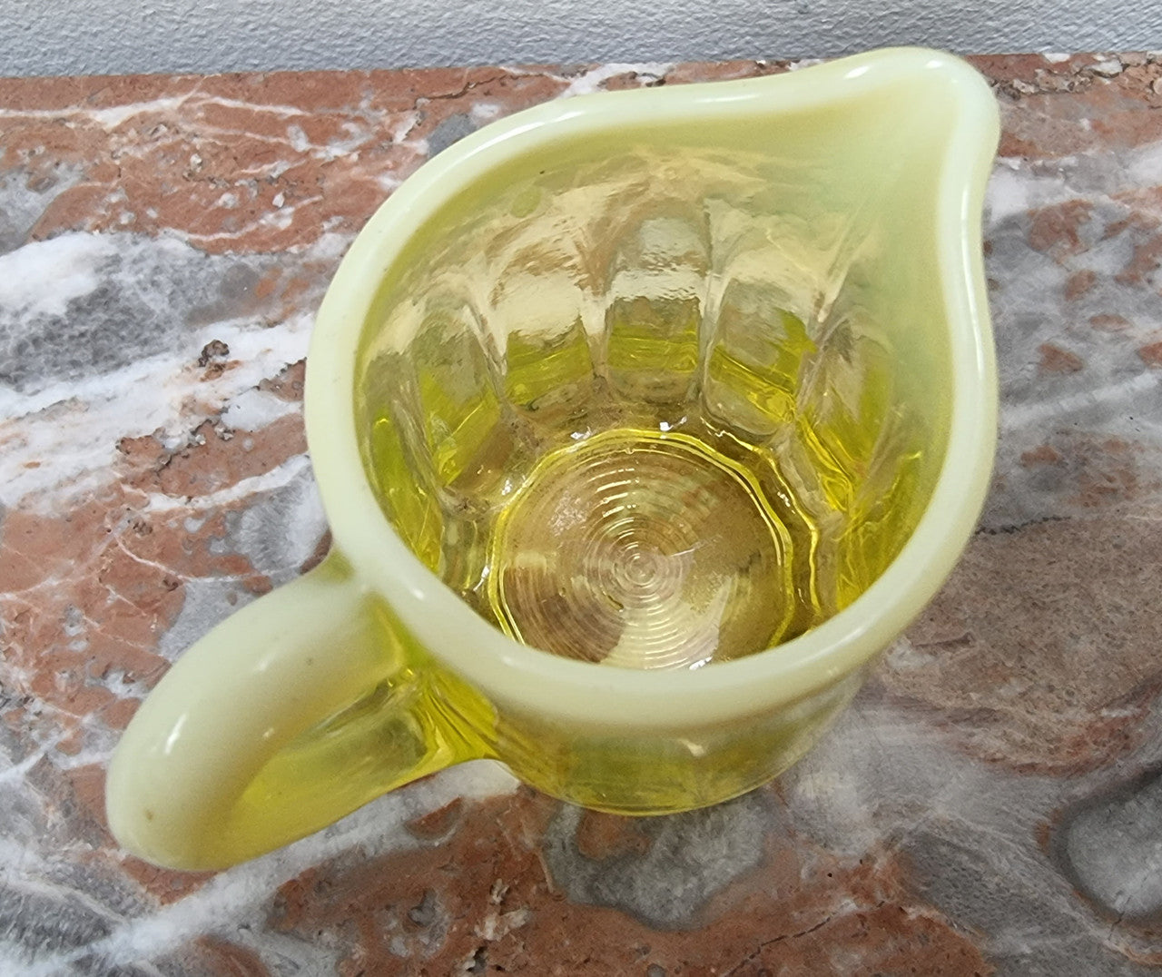 A fabulous rare Vaseline glass small jug and sugar bowl in good original condition.