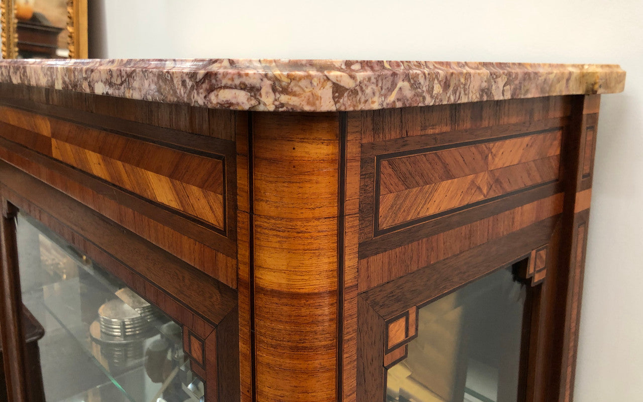 Beautiful French walnut and parquetry inlaid vitrine with lovely bevelled glass and a marble top. It comes with four glass shelves which are adjustable and it is in good original condition.