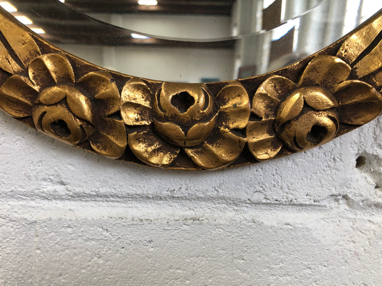 Beautiful French decorative Art Deco giltwood wall mirror with lovely floral detail. Contains its original mirror and is in good original condition.