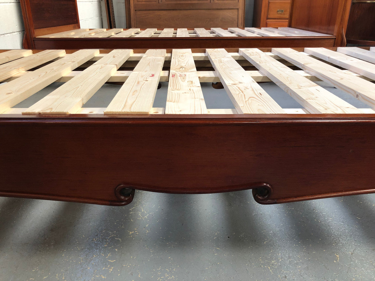 Rare French king single walnut bed, circa 1900. In good original condition. We currently have two matching kind single beds but they are being sold separately.