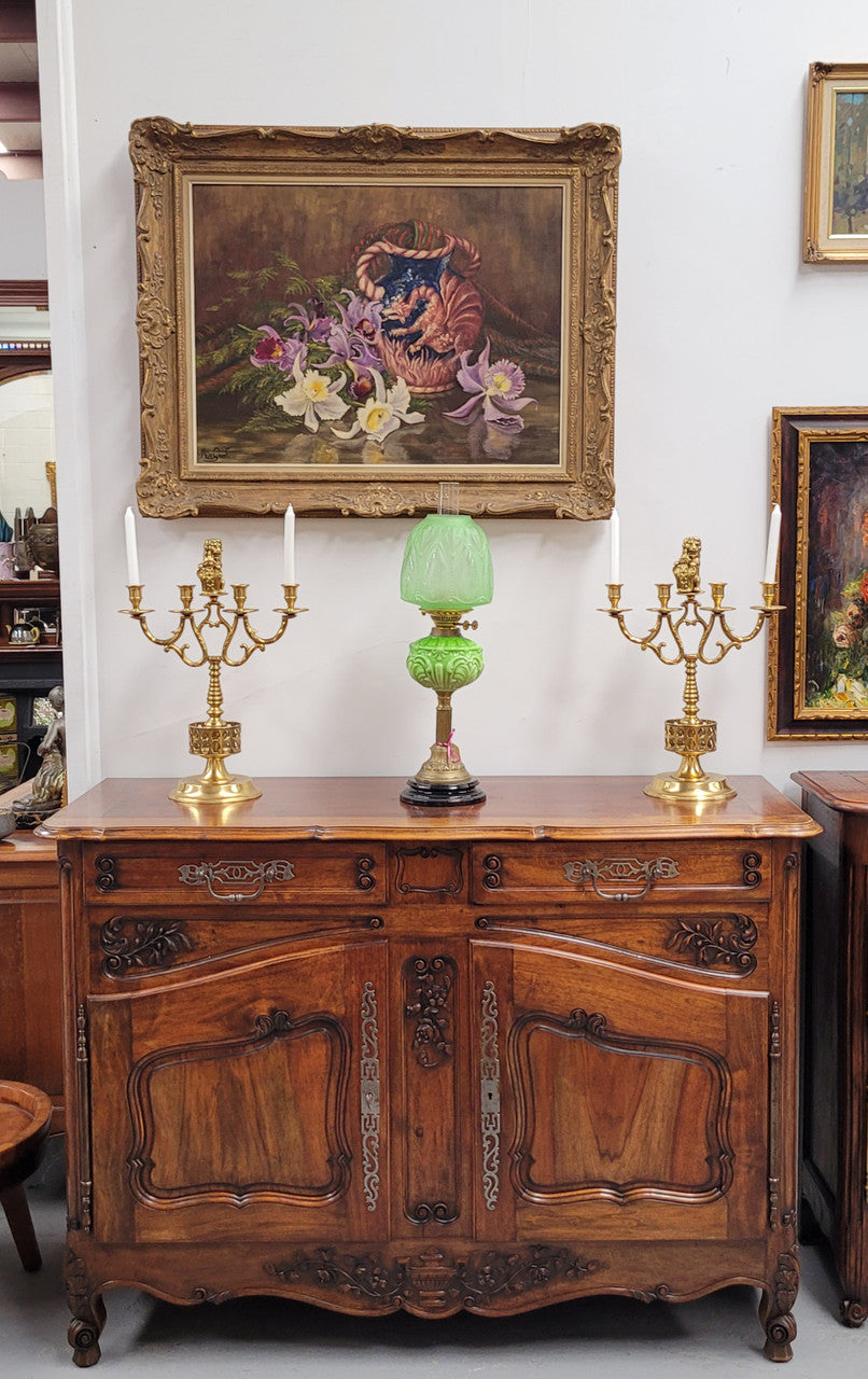 Attractive French Walnut Louis XV style two door two drawer sideboard featuring beautiful carving. Circa: 1930's. It has been sourced from France and it is in good original detailed condition.