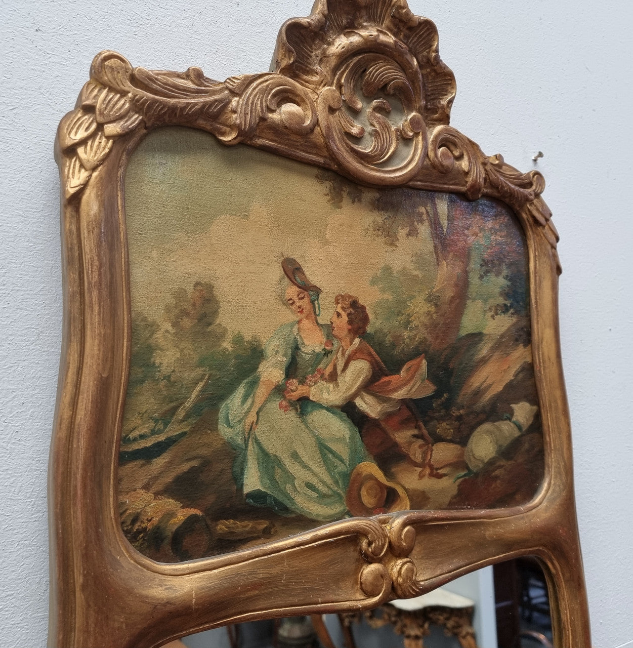 Stunning 19th Century French hand-painted wall mirror. The beautiful painted top panel of a couple in a lovely gold painted frame, in good original detailed condition.