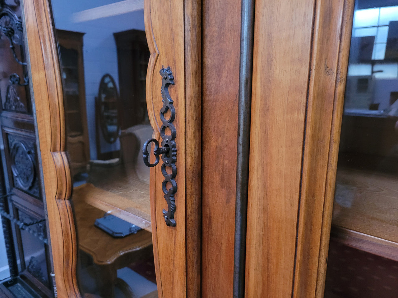 Magnificent French Walnut two-body four door display cabinet. Heaps of storage space with four glass doors at the top with shelves and four solid doors below also with shelving. It has been sourced from France and comes with a key for each door and all are lockable. In good original detailed condition.
