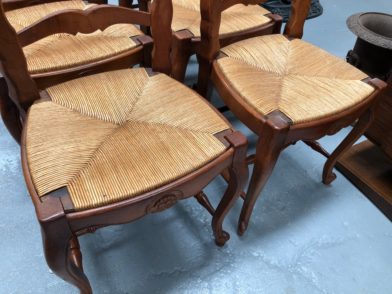 Antique set of six French Cherrywood rush seat dining chairs. In good original detailed condition.