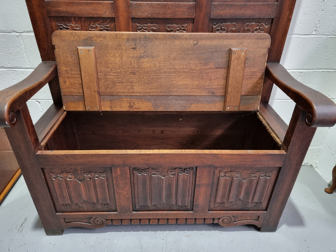 Decorative and nicely carved French Oak 19th Century hall seat with lift up lid for storage. Beautiful details and in good original detailed condition.