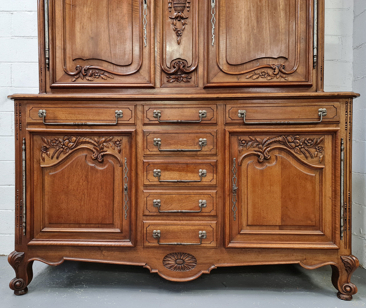 Beautiful 19th century Walnut Louis XV style sideboard with plenty of storage space. The top has two doors that open up to three adjustable shelves. It is in good original detailed condition.