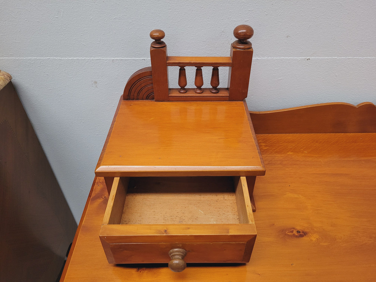 Late Victorian Huon Pine desk with two drawers. Featuring superb birdseye panels and is in good original detailed condition.