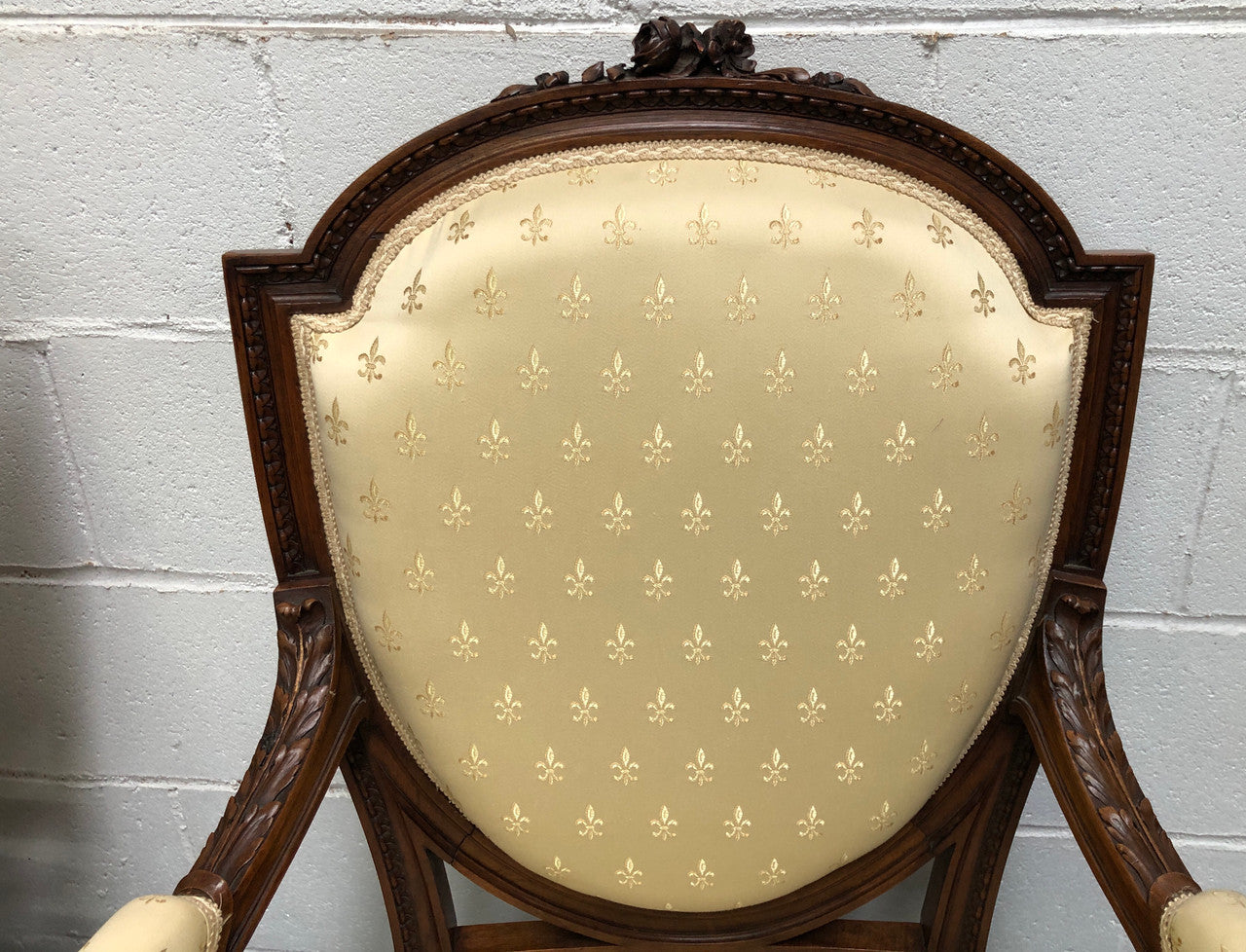 Beautiful pair of Vintage French Walnut Louis XVI style carved Fauteuils with lovely upholstery and wide seats . In good original detailed condition.