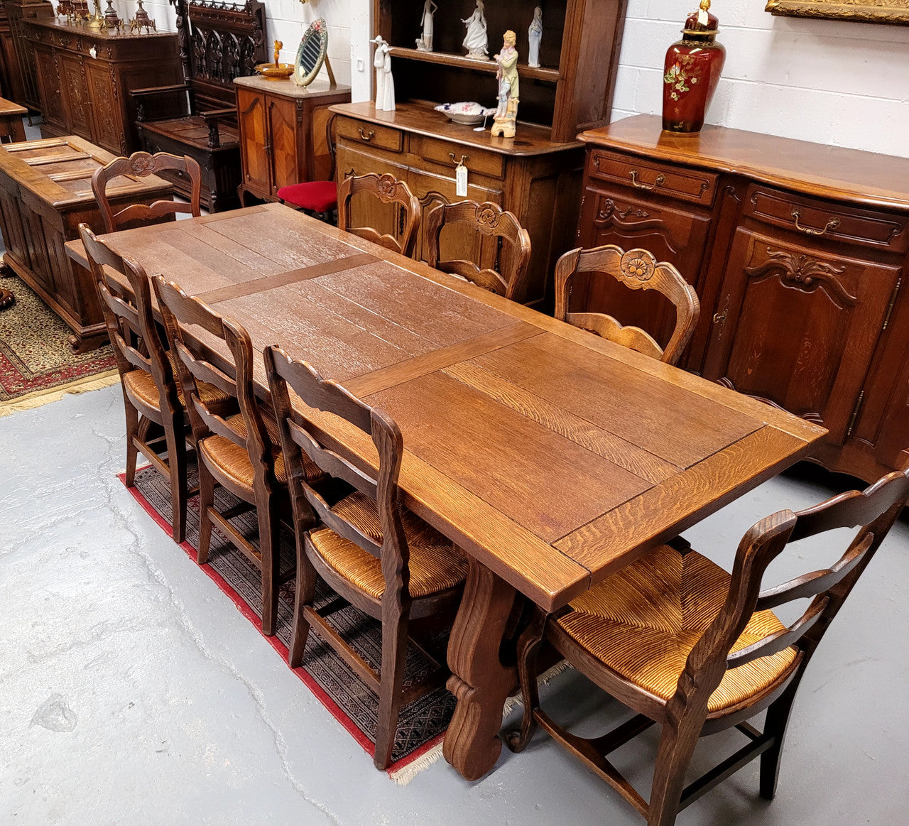 Purchased from France we have this amazing French Oak Spanish style farmhouse table featuring striking iron work underneath. It has been finished with an oil & wax finish making it more water resistant, stain resistant and durable then a natural wax finish. It can sit 6-8 people comfortable and is good restored condition.