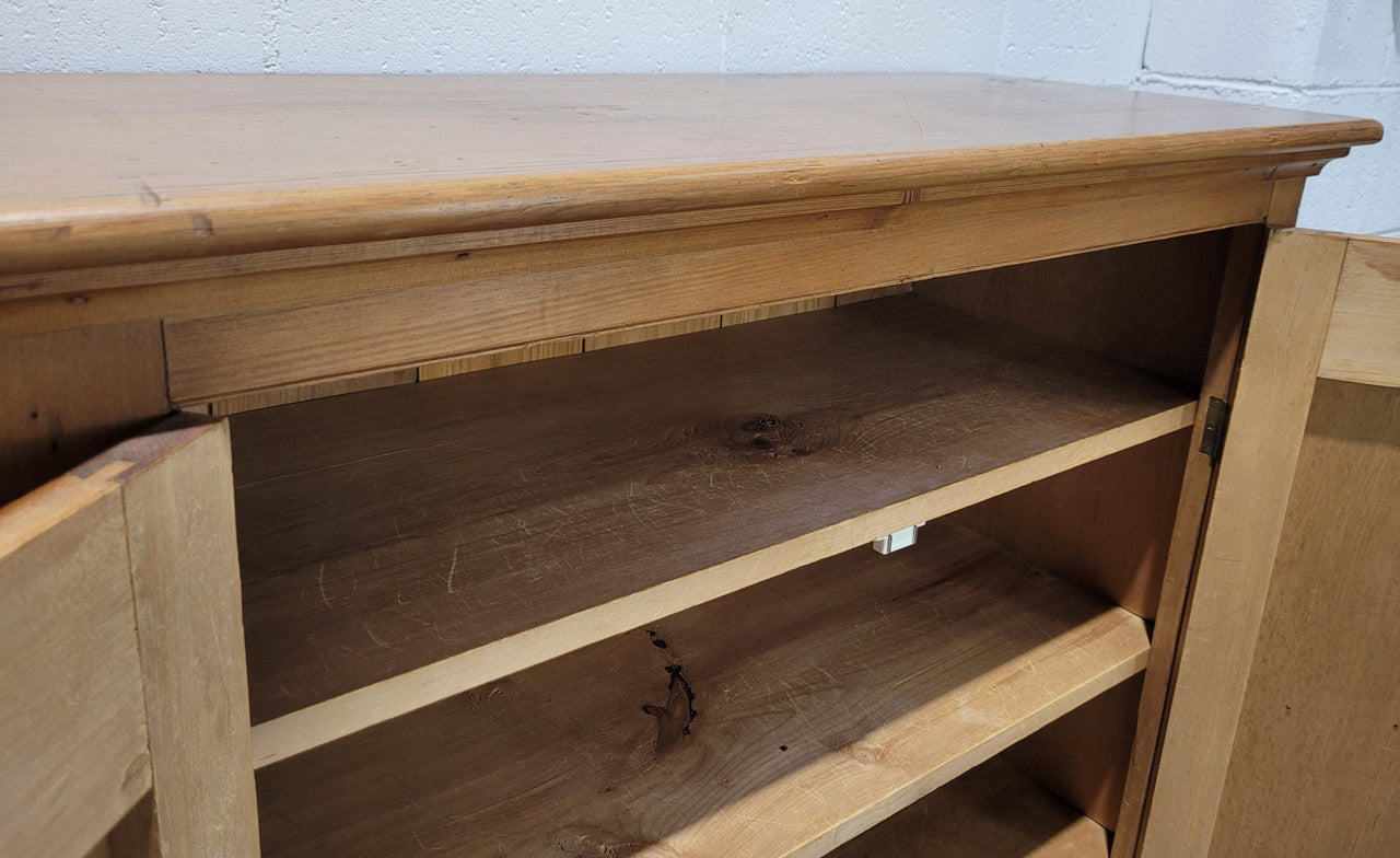 A lovely Victorian Pine shield cupboard with two doors and four shelves in good original detailed condition.