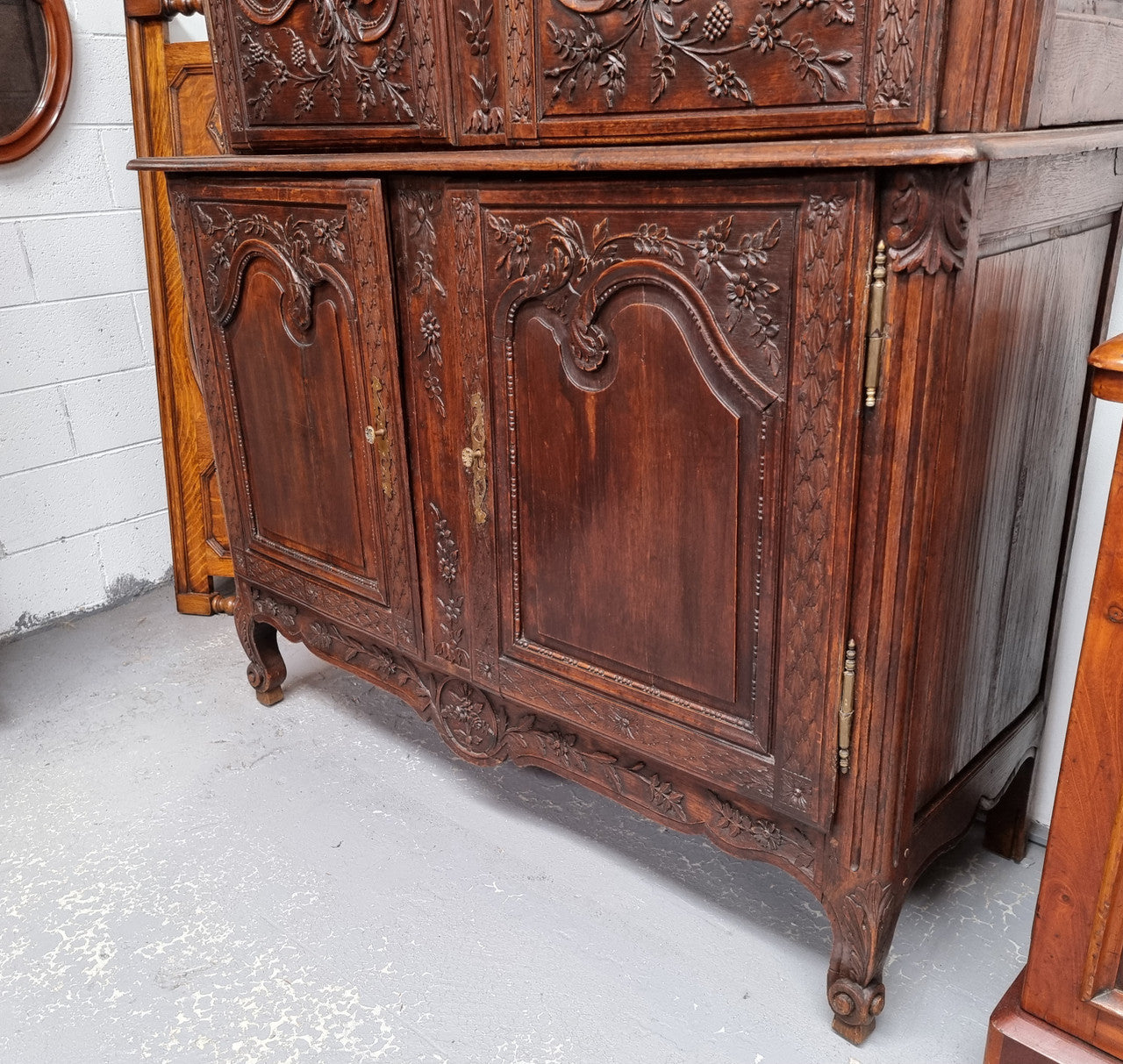 French Oak 18th Century superbly carved sideboard buffet. This amazing buffet has loads of character which is expected being circa 1790's. The top section has two fixed shelves and the bottom section has one fixed shelf. It has been sourced from France and is in good original detailed condition.