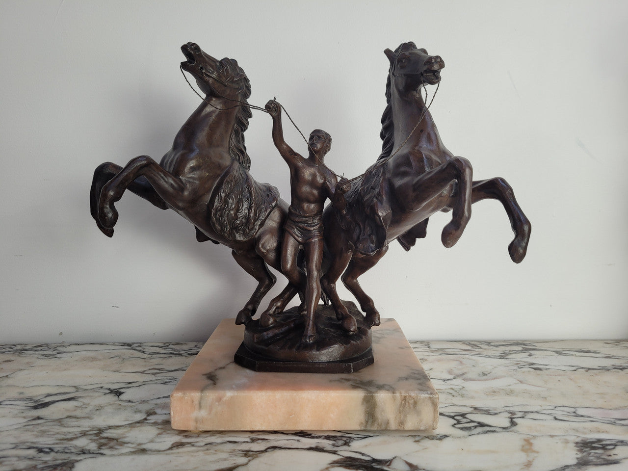 French Art Deco cold painted bronze metal marley horses style statue on a marble base. It is in good condition.