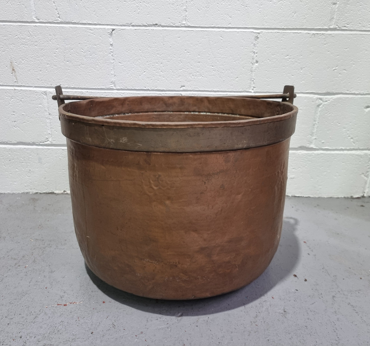 Large Antique French copper cauldron with metal band around rim. It is in good original condition.