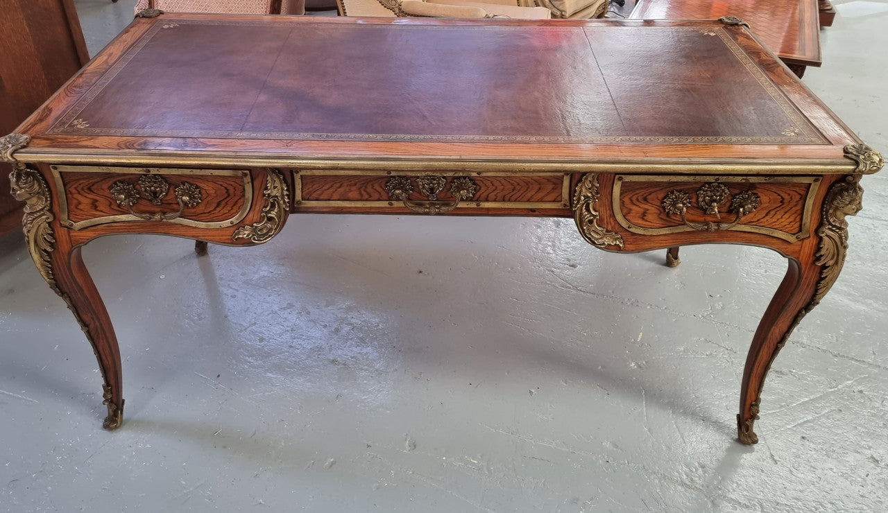 Beautifully fully restored French Antique Rosewood partners desk with beautiful ormolu detail and lovely tooled new leather top. There are three functioning drawers on one side for all your storage needs.