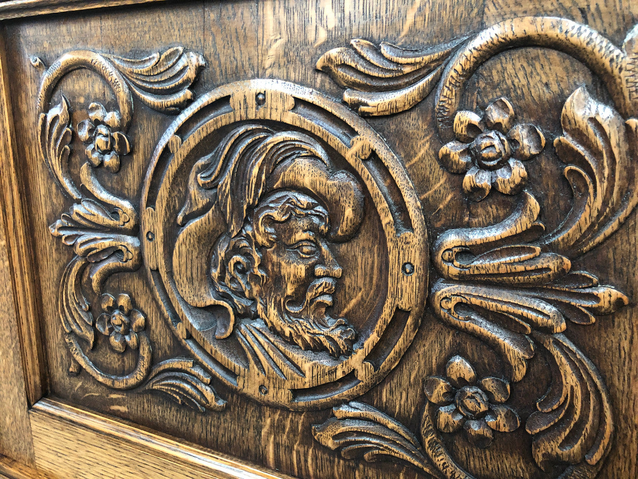 French Oak beautifully carved Renaissance style sideboard with four drawers. Beautiful wax finish and is in good original detailed condition.