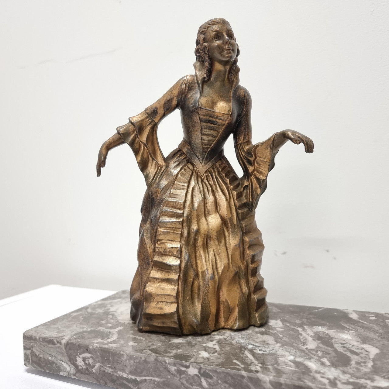 Art Deco gilt metal lady and deer statue on a lovely grey marble base. It has been sourced from France and is in good original condition. The marble does have some minor chips and wear due to age, please view photos as they help form part of the description. Please contact us if you would like additional photos.