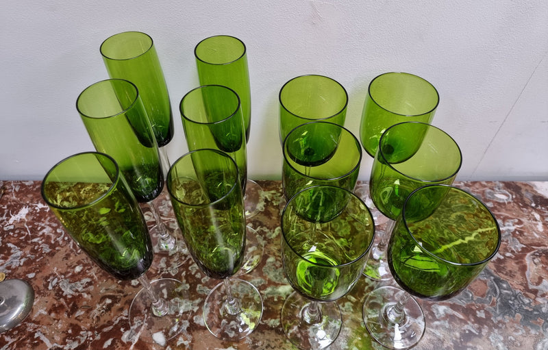 Beautiful set of 12 Vintage emerald green hand made wine glasses. Possibly Italian or French. They are in good original condition with no chips or cracks.