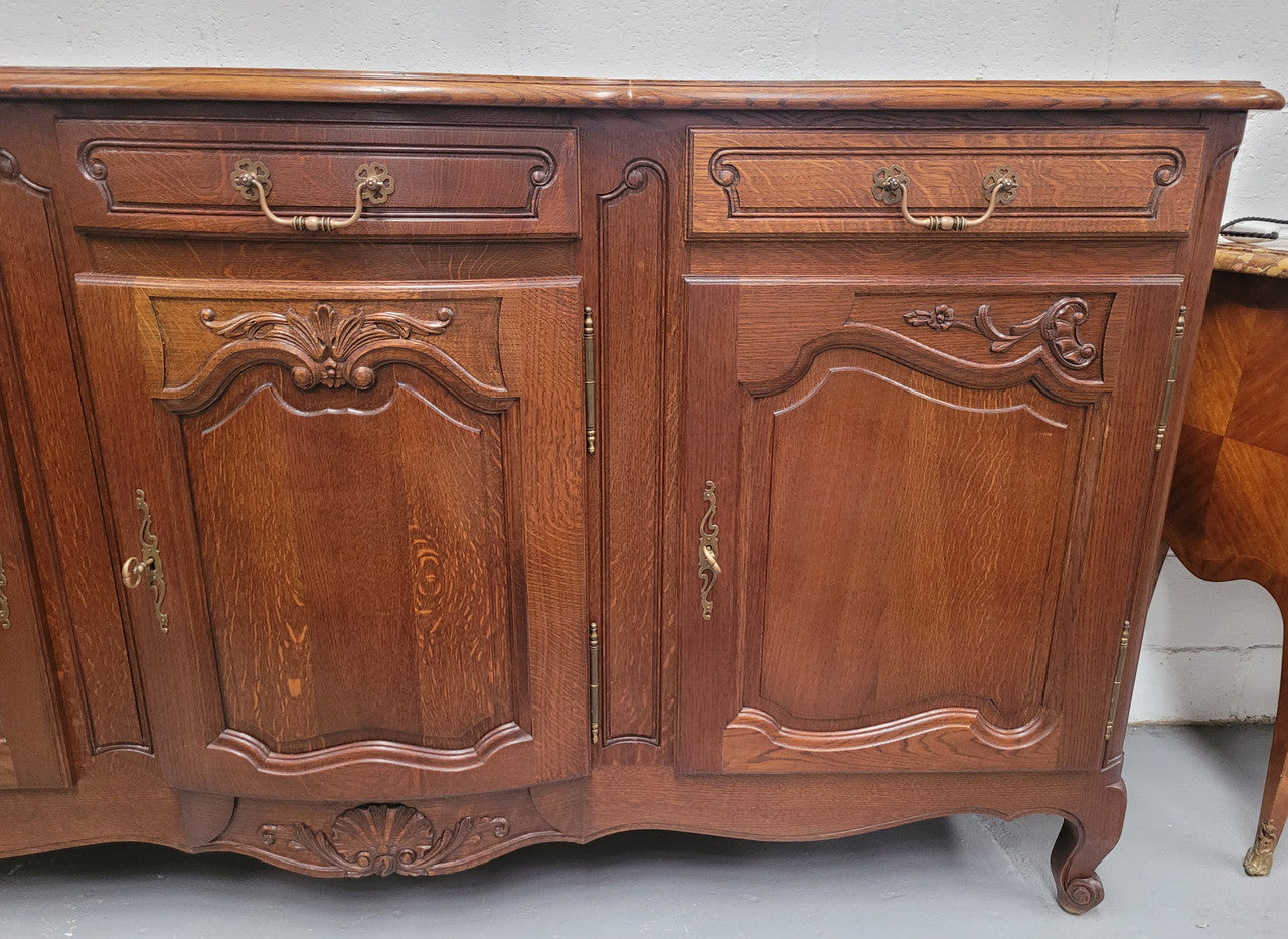 French Oak Louis XV style three drawer three door parquetry top sideboard. It has been sourced from France and is in good original detailed condition.