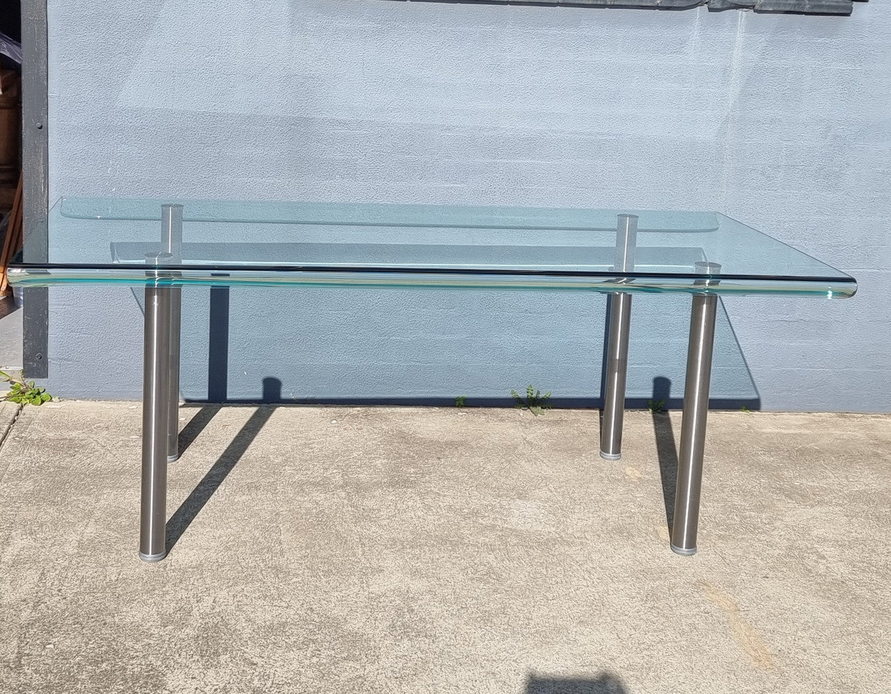 Striking and distinctive Vintage FIAM Italia Designer curved edge glass desk. FIAM was founded in 1973 by Vittorio Livio and has become synonymous with glass culture in Italy and the World. FIAM is still manufacturing today, in collaboration with various Designers, and has won numerous awards and is represented in various international museums. 
Condition: Evidence of use with minor scratches to the surface and a small chip that has been repaired. Overall, in very good condition with one repaired chip to t