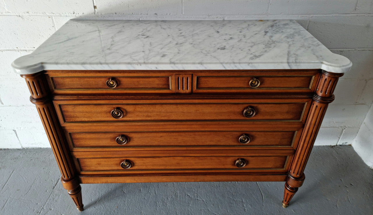 Beautiful French Louis XV Style Marble top five drawer commode. There are five drawers and it has a lovely brass inlay. It is in good original detailed condition.