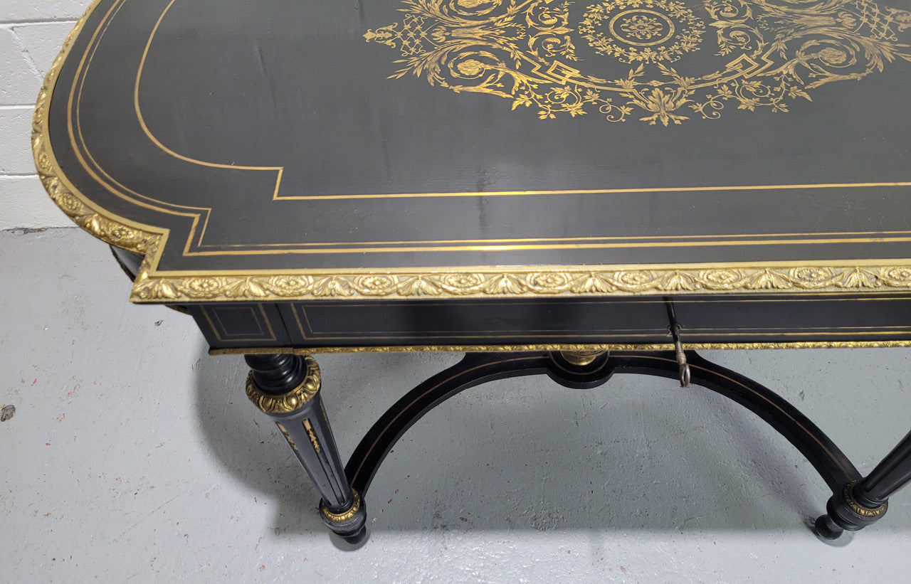 19th Century Napoleon III boulle ebonized centre table. Beautiful decorative mounts and has a drawer on one side. In good restored condition.