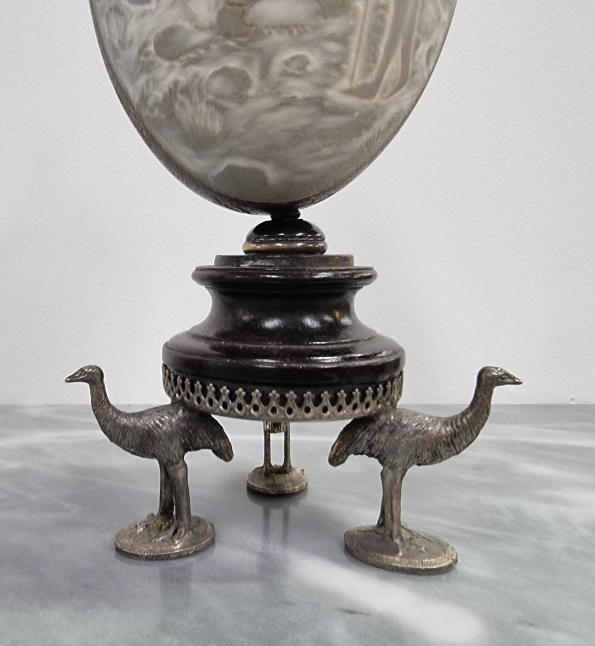 Superbly carved Emu egg on a emu metal and ebony base. It depicts an Aboriginal hunting scene and dreaming's. It is in good original condition, please view photos as they help form part of the description.