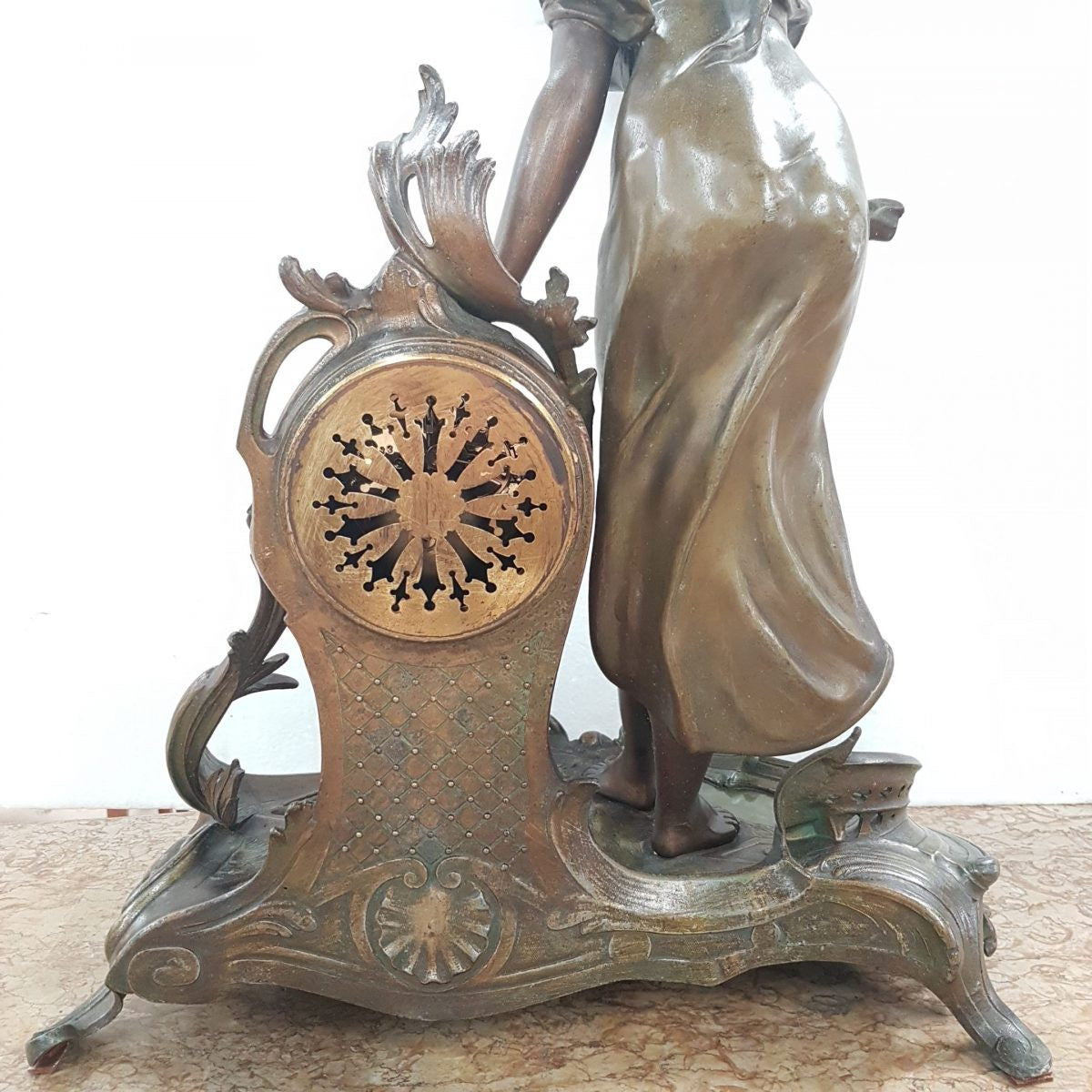 An elegant French Art Nouveau figural clock, with onyx marble depicting water and constructed from spelter. The clock is 61cm high and is in good original condition and in working order.