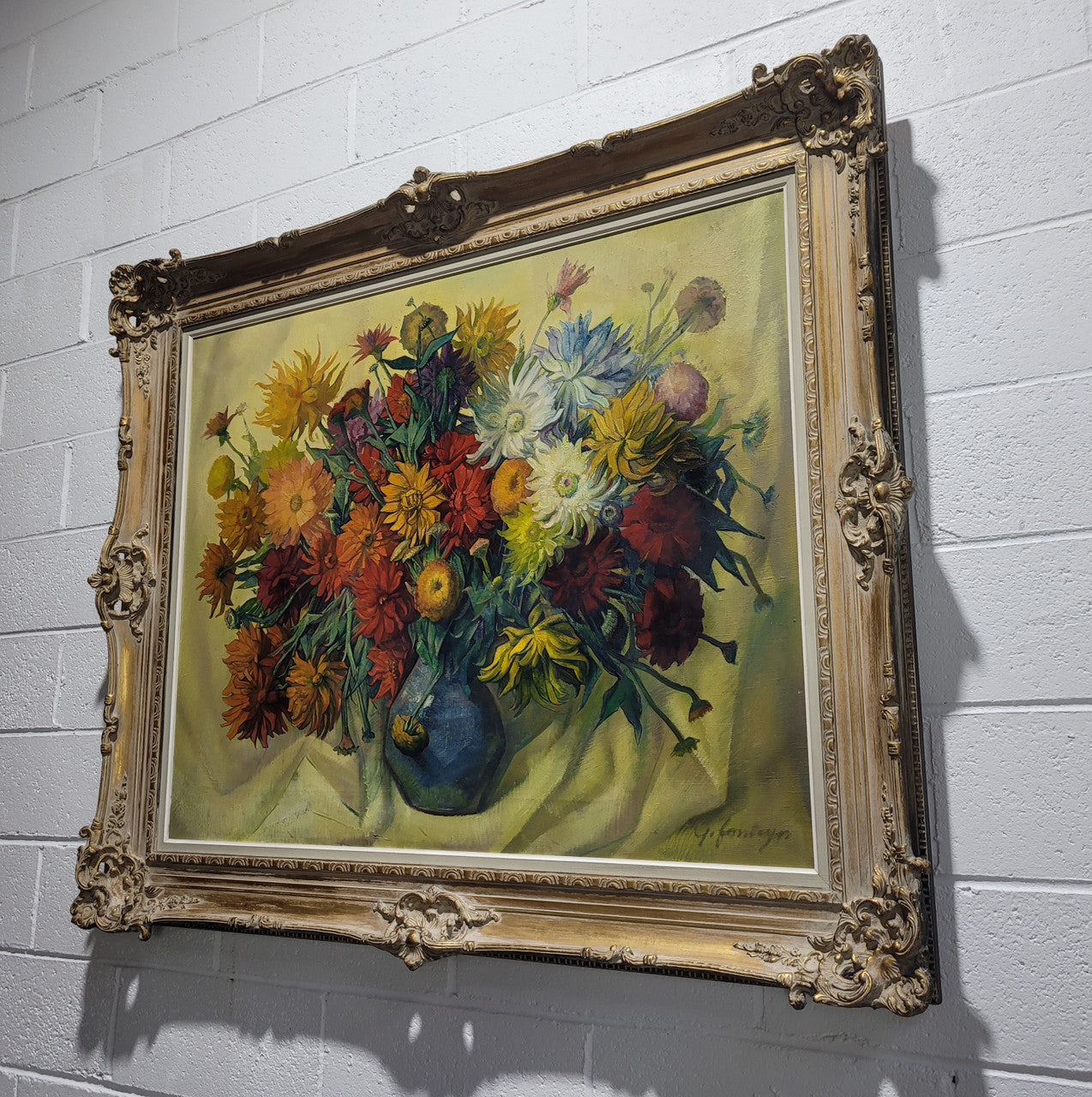 Large vibrant French oil on canvas of flowers and signed “Y.Fonteyn". In an amazing gilt frame and is in good original condition.