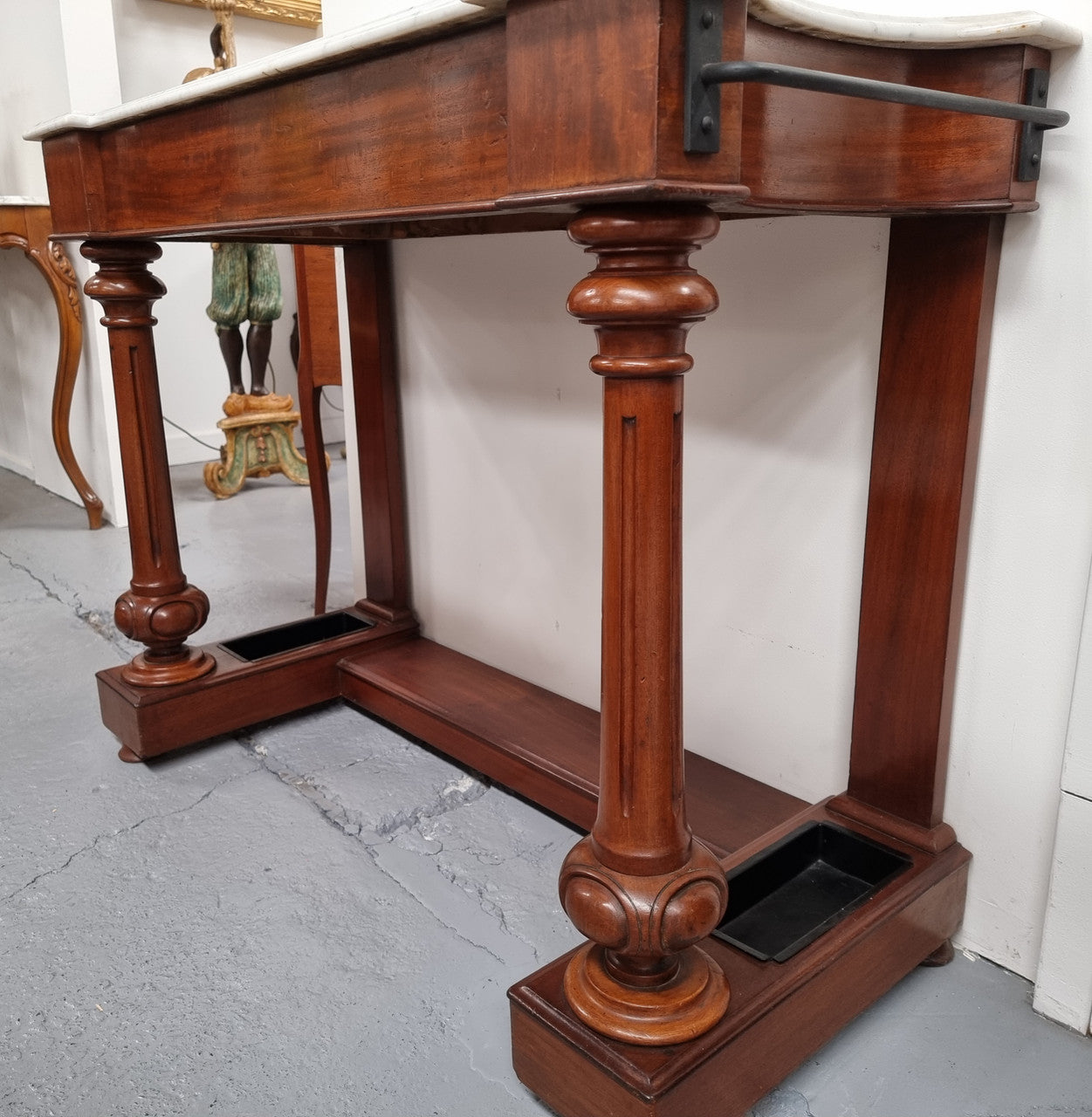 Classic Victorian mahogany console table with white marble top, one drawer and accommodation for sticks/umbrellas. In good original detailed condition.