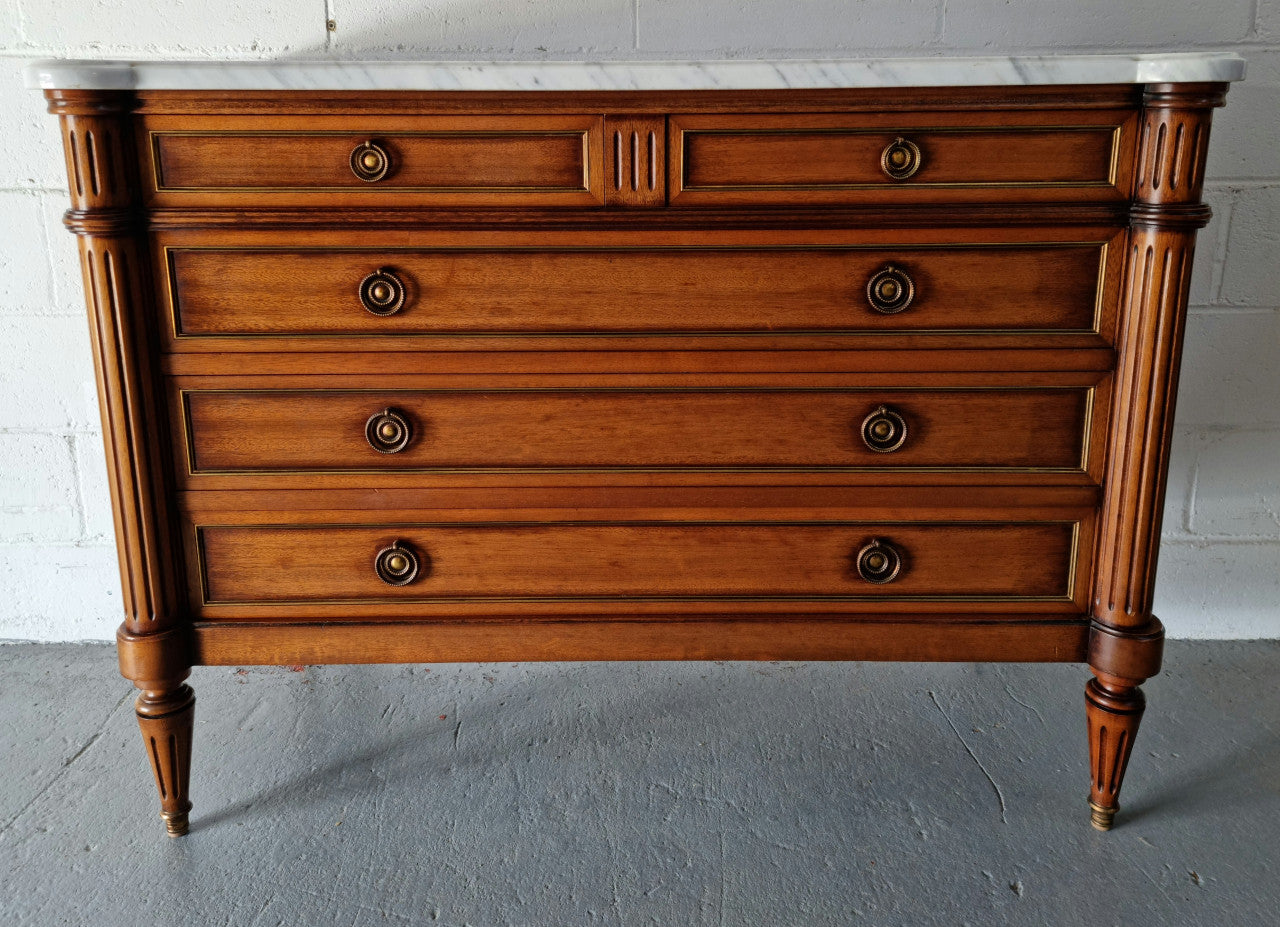 Beautiful French Louis XV Style Marble top five drawer commode. There are five drawers and it has a lovely brass inlay. It is in good original detailed condition.