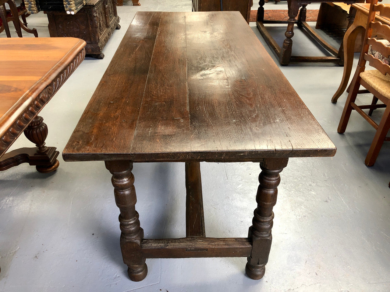 Early 19th Century French Oak petite size dining table. It seats six comfortably and would be ideal for an area with limited space. In very good original detailed condition.