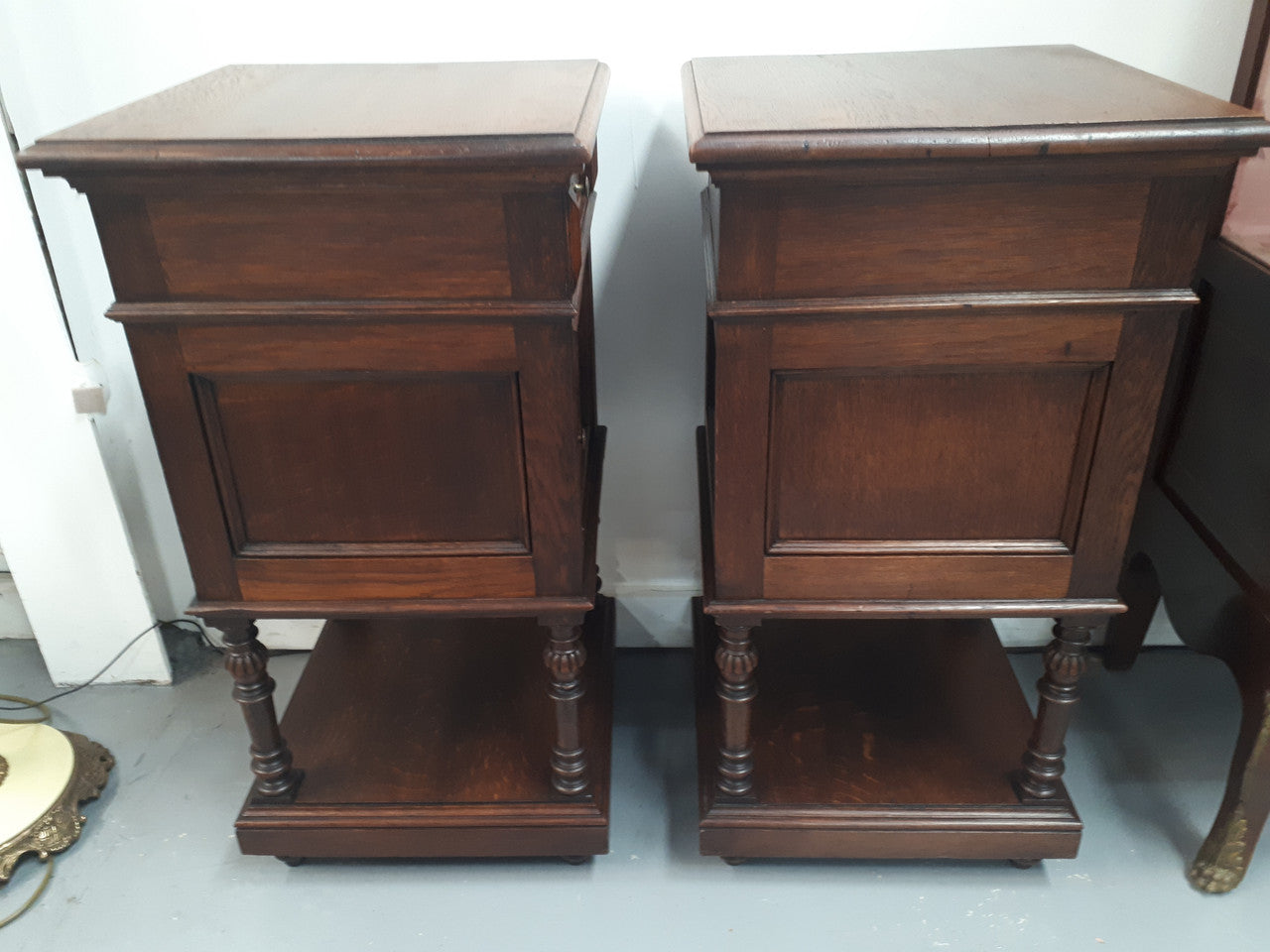 A hard to find pair of French Oak wooden top bedside cabinets. In good original condition. Circa 1920.